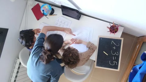Mother helping her son do homework back to schoo Vídeos de archivo 270483766