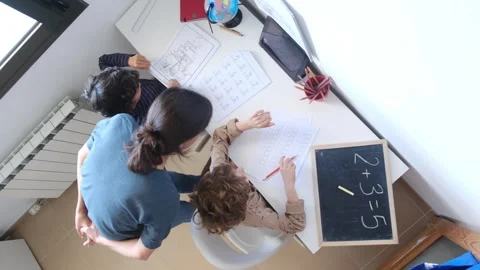 Mother helping her son do homework back to schoo Vídeos de archivo 270483773
