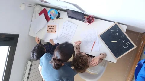 Mother helping her son do homework back to schoo Vídeos de archivo 270483780