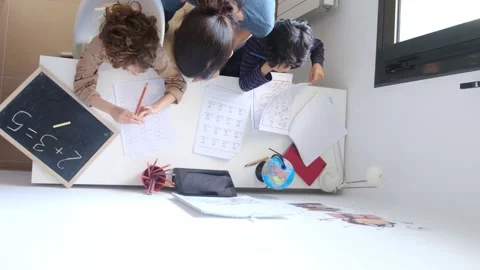 Mother helping her son do homework back to schoo Vídeos de archivo 270483794