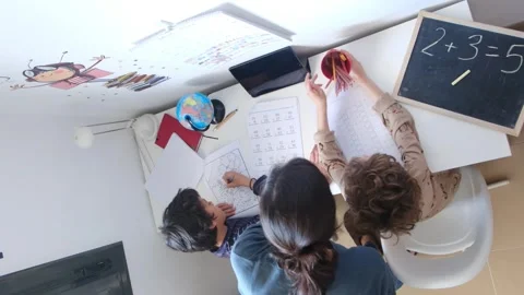 Mother helping her son do homework back to schoo Vídeos de archivo 270483806