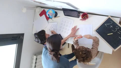 Mother helping her son do homework back to schoo Vídeos de archivo 270483810