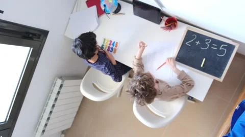 Mother helping her son do homework back to schoo Vídeos de archivo 270483815