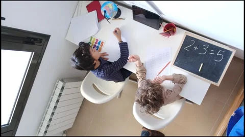 Mother helping her son do homework back to schoo Vídeos de archivo 270483822