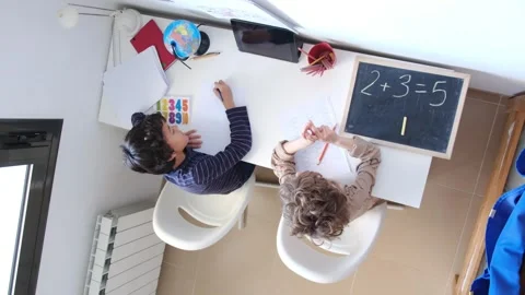 Mother helping her son do homework back to schoo Vídeos de archivo 270483827