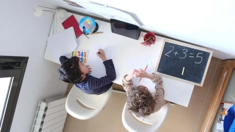 Mother helping her son do homework back to schoo Vídeos de archivo 270483839