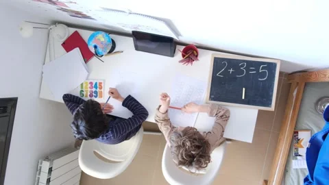 Mother helping her son do homework back to schoo Vídeos de archivo 270483858