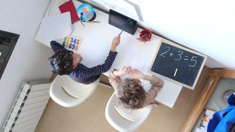 Mother helping her son do homework back to schoo Vídeos de archivo 270483860