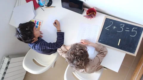 Mother helping her son do homework back to schoo Vídeos de archivo 270483891