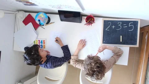Mother helping her son do homework back to schoo Vídeos de archivo 270483923