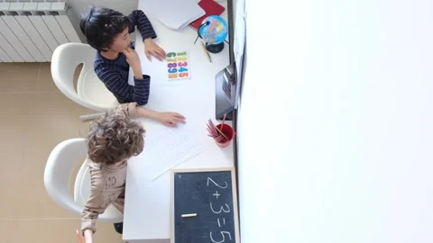 Mother helping her son do homework back to schoo Vídeos de archivo 270483930