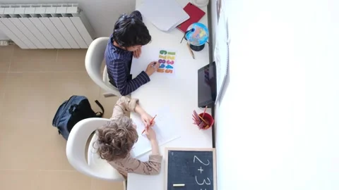 Mother helping her son do homework back to schoo Vídeos de archivo 270483940