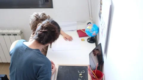 Mother helping her son do homework back to school. Stock Footage 270484242