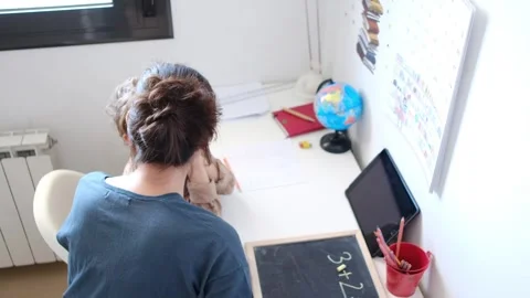 Mother helping her son do homework back to school. Stock Footage 270484262