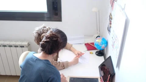 Mother helping her son do homework back to school. Stock Footage 270484265