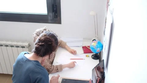 Mother helping her son do homework back to school. Stock Footage 270484273