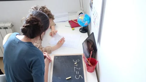 Mother helping her son do homework back to school. Stock Footage 270484280