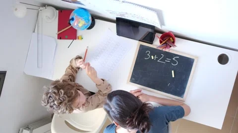 Mother helping her son do homework back to schoo Stock Footage 270484292