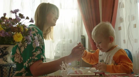 Mother Helping Her Son in Having Lunch Stock Footage 56718215