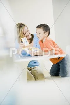 Mother helping son learn math Stock Photos