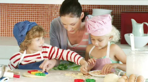 Mother with her Children in the Kitchen Stock Footage