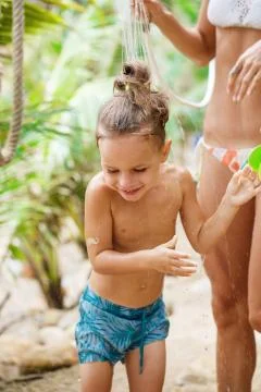 Mother with her son are taking shower Stock Photos