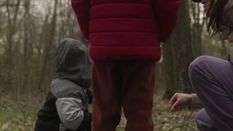 Mother with her two children exploring autumn nature forest. Enjoying nature Stock Footage 246648794
