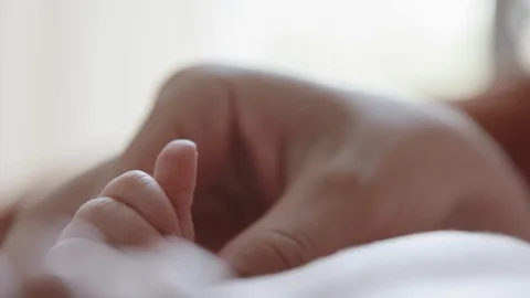 Mother hold her baby hands Stock Footage