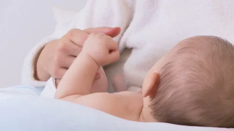 Mother holding babys hand Stock Footage