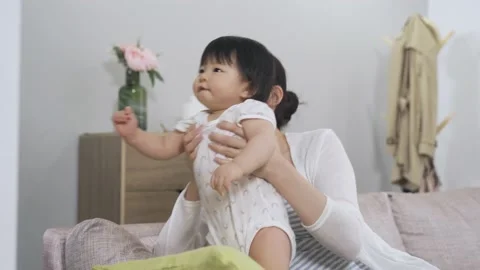 Mother holding her daughter up is pointing Stock-Footage 200451753