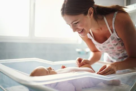 Mother holding her newborn baby child after labor in a hospital Stock Photos