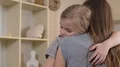 Mother hugging little daughter with love, tender family relationship, support 4k or 4k+ Resolution