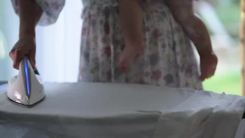 Mother ironing Stock Footage 311888987