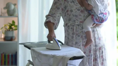Mother ironing Stock Footage 311889029