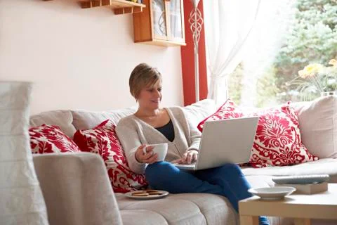 Mother on laptop computer Stock Photos