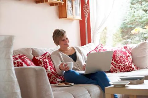 Mother on laptop computer Stock Photos