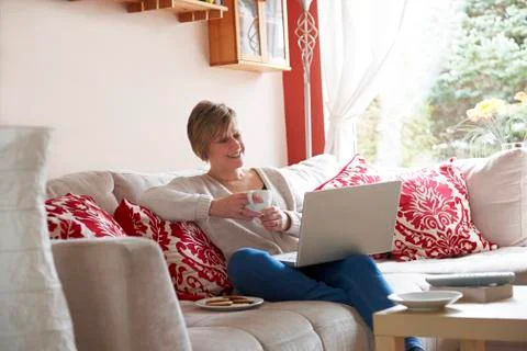 Mother on laptop computer Stock Photos