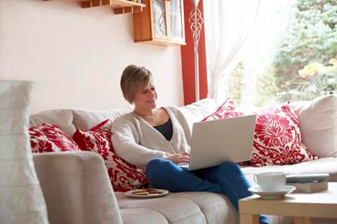 Mother on laptop computer Stock Photos