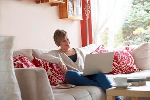 Mother on laptop computer Stock Photos