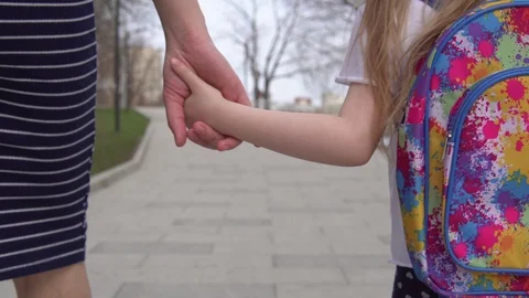 Mother leads child to elementary school. Stock Footage 108451419