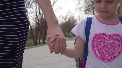Mother leads child to elementary school. Stock Footage 108451499