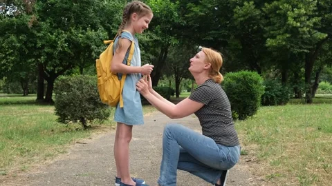 Mother leads daughter in classes. Back to school. First day of fall Video stock 244963598