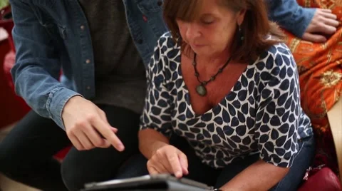 Mother Learns How to Use Tablet Stock Footage 53471387