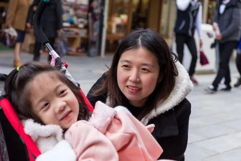 Mother Looking at Daughter, Selective Focus Stock Photos