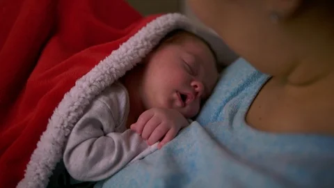 Mother looking down at newborn son Stock Footage 98612139