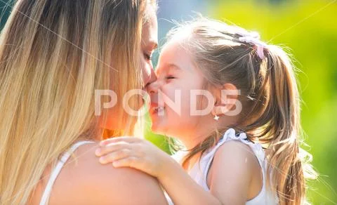 Mother love. Mother and child girl playing kissing and hugging. Little daughter Stock-Fotos
