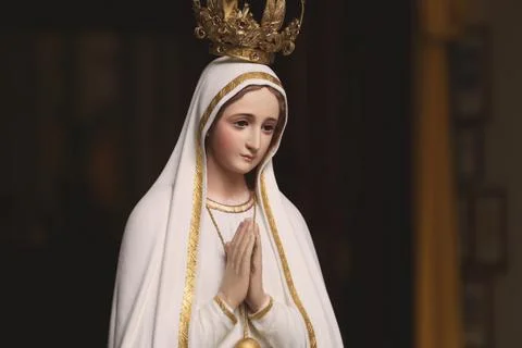 Mother Mary Statue in Catholic Church Praying virgin saint Stock Photos