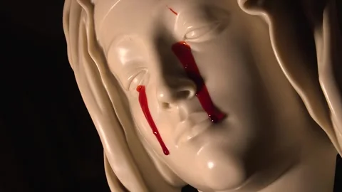 Mother Mary Statue Face Crying Blood from Both Eyes Pietà Stock Footage 323144255