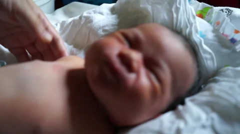Mother massaging and checking newborn baby skin Stock Footage 45805037