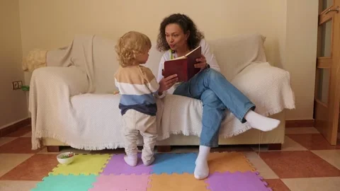 Mother Multitasking Home Office Work While Entertaining Her Baby Stock Footage 305283298